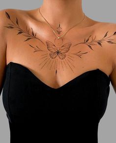 a woman with a butterfly tattoo on her chest