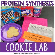 a cookie lab with cookies, candy and other snacks on the table next to it