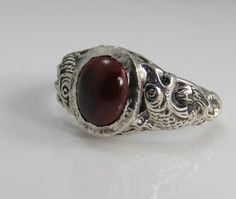 Estate sterling silver mans garnet ring size 9. great pre-owned condition. 5 grams. 12.36mm wide in front. Garnet Ring Men, Mens Garnet Ring, Ring Men, Victorian Rings, Antique Engagement, Garnet Ring, Red Band, Antique Engagement Rings, Diamond Rings Bands