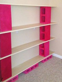 there is a pink and white shelf in the room