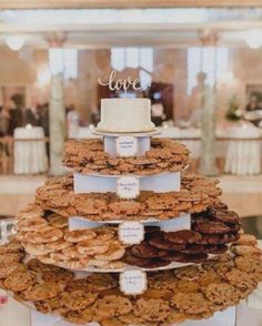 a wedding cake made out of cookies on top of a table