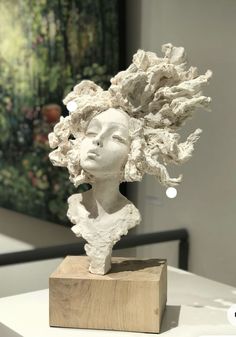 a sculpture of a woman's head is on display