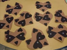 some brown and black heart shaped cookies on a table