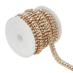 a roll of gold and white beaded ribbon