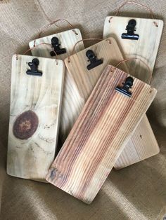 four wooden luggage tags sitting on top of a bed next to each other with the words recipe holder etsy