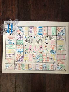 a game board with the words let's get lit on it and some candy