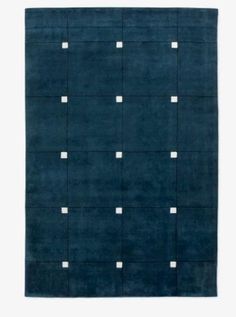 a blue rug with white squares on the top and one square is in the middle