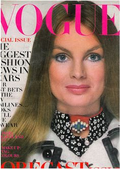 a magazine cover with a woman wearing a collared shirt and necklace on the front