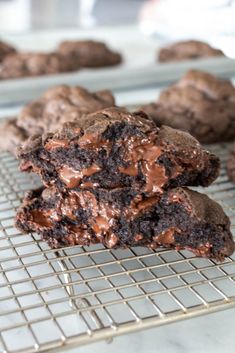 chocolate cookies are cooling on a wire rack