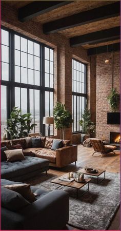 a living room filled with lots of furniture and large windows next to a fire place