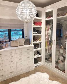 an instagram photo of a closet with lots of white furniture and accessories on display