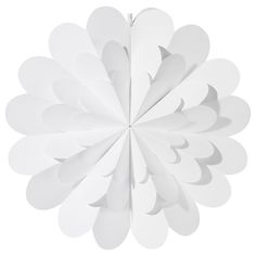 a white paper flower hanging from the ceiling with its petals cut out to look like leaves