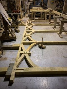 the wooden frame is being constructed in a workshop