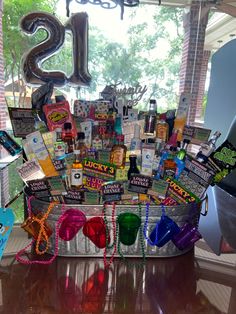 a bucket filled with lots of items on top of a table