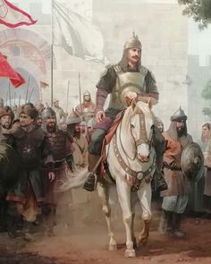 a man riding on the back of a white horse next to a crowd of people