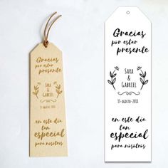 two tags with gold ink on them, one is for an event and the other is for