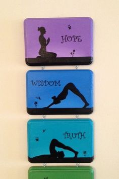 three magnets with yoga images on them