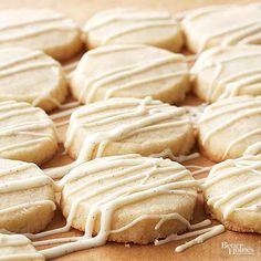 iced cookies with white icing on a wooden table