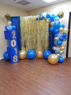 balloons and streamers decorate the entrance to a new year's party