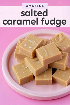 a white plate topped with pieces of fudge next to a pink tablecloth on top of a wooden table