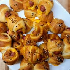 hot dogs wrapped in crescented bread on a plate