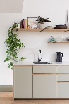 the kitchen is clean and ready for us to use it's counter tops are made of wood