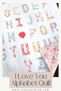 i love you alphabet quilt pattern on the front and back of a quilted blanket