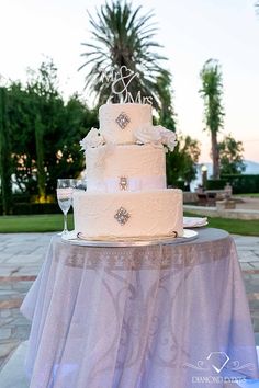 a wedding cake sitting on top of a table