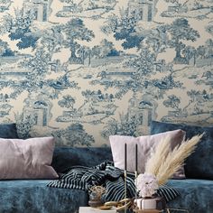 a living room with blue and white wallpaper