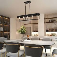 a dining room table and chairs in front of a bookcase