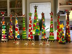 colorfully decorated wine glasses on a wooden table