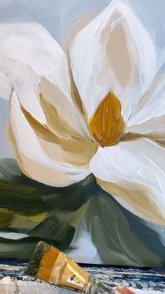 an oil painting of a white flower with gold stipples next to it