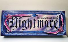 a wooden sign that says nightmares on the front and back of it with pink flowers