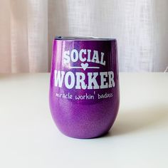 a purple wine glass with the words social worker on it sitting on a white table