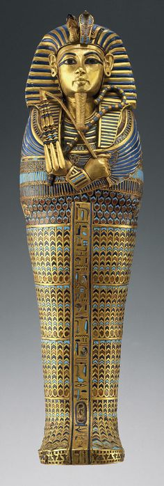 an egyptian style vase with gold and blue decoration