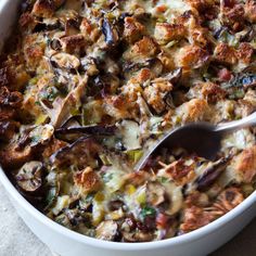 a casserole dish with meat and vegetables in it is ready to be eaten