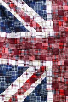 the union jack flag is made up of red, white and blue plaid fabric that has been stitched together