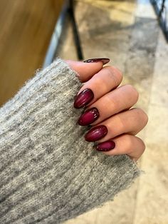 Plum Wine Aura Nails, Almond Short Nails Fall, Cool Girl Fall Nails, Red Brown Almond Nails, Berry Colored Nails Acrylic, Wine Aura Nails, Cranberry Nails Christmas, Maroon Glitter French Tip Nails, Alternative Holiday Nails