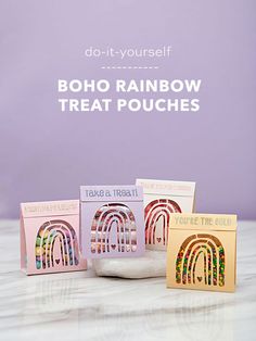 three rainbow treat pouches sitting on top of a marble counter with the words do - it - yourself