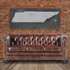 a brown leather couch sitting in front of a brick wall Tennessee Map, Park Forest, Framed Map, Tennessee State, Push Pin Map, Cow Canvas, Box Store, Pin Map, Holy Cow