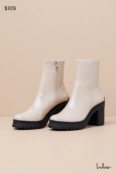 Gain cool girl status the moment you step out in the D'Amelio Footwear Helenna Ivory Textured Patent Platform Lug Sole Ankle Boots! Crinkle-textured patent faux leather shapes these trend-setting boots with a rounded-toe upper that rises to an ankle-high shaft with seam detailing (all atop a 1"" toe platform). A 5.75"" zipper at the instep makes for effortless on-and-off, while a contrasting, black chunky block heel with a lug sole completes the look! 3. 25" block heel. Lightly cushioned insole. Rubber sole has nonskid markings. Man Made Materials. Imported. Lulus | Helenna Ivory Textured Patent Platform Lug Sole Ankle High Heel Boots. Ankle High Heel Boots, Girls Status, Nashville Outfits, Chunky Block Heels, Spring Shoes, Heel Boots, Lug Sole, High Heel Boots, Platform Shoes