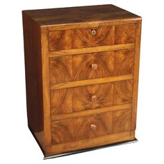 a wooden dresser with three drawers on it