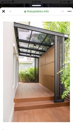 an outdoor covered walkway with wooden steps