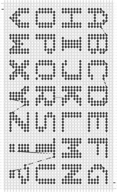 a black and white dotted pattern with letters