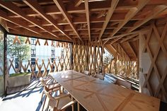 a wooden table and chairs in a room