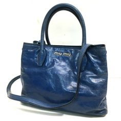 Item Information ITEM NO.: 22000-14453-11 NAME: MIUMIU Shoulder Bag Logo Hardware Hand Bag Hand Bag COLOR: blue MATERIAL: Leather APPROX SIZE: W10.2×H7.9×D5.1inch / W26cm×H20cm×D13cm Listed hand measurements may have a 1-2cm difference. Gender: Women's Spec: [Open type]Magnet type [Inside] Zipper pocket x 2,Open pocket x 1 ADDITIONAL ITEMS: Dust Bag , Shoulder strap , ITEM RANK: Used AB Rank CONDITION DETAILS: Outside:fading of color Handle - Strap:Wrinkles,fading of color Metal fittings part:Mi Luxury Blue Shoulder Bag With Top Carry Handle, Luxury Blue Shoulder Bag, Classic Miu Miu Bags For Everyday, Miu Miu Travel Tote Shoulder Bag, Miu Miu Tote Shoulder Bag For Travel, Designer Blue Bag With Top Carry Handle, Miu Miu Rectangular Travel Bags, Designer Blue Shoulder Bag For Daily Use, Designer Blue Bags For Everyday Use