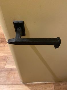 a black handle on the side of a door