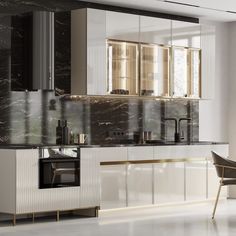 a modern kitchen with marble counter tops and white cabinetry, along with a dining room table