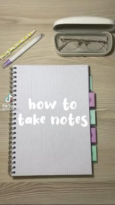 a notepad with the words how to take notes written on it next to a pen and glasses