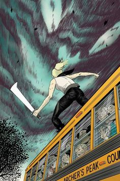 a man riding on the back of a school bus under a stormy sky with clouds